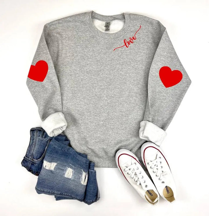 Sweatshirt femme avec design cœur et coupe décontractée Chic & Stil