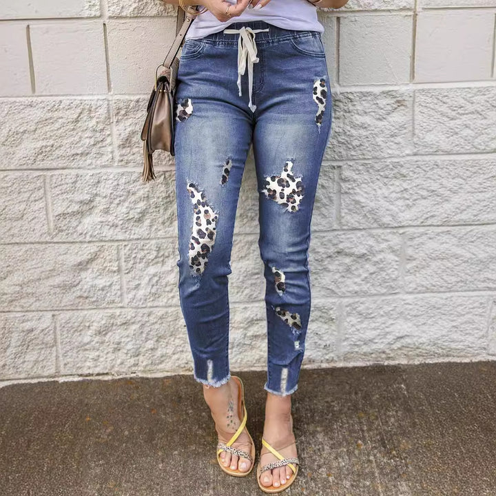 Trendy skinny jeans for women with a unique leopard design and ripped details Lune London