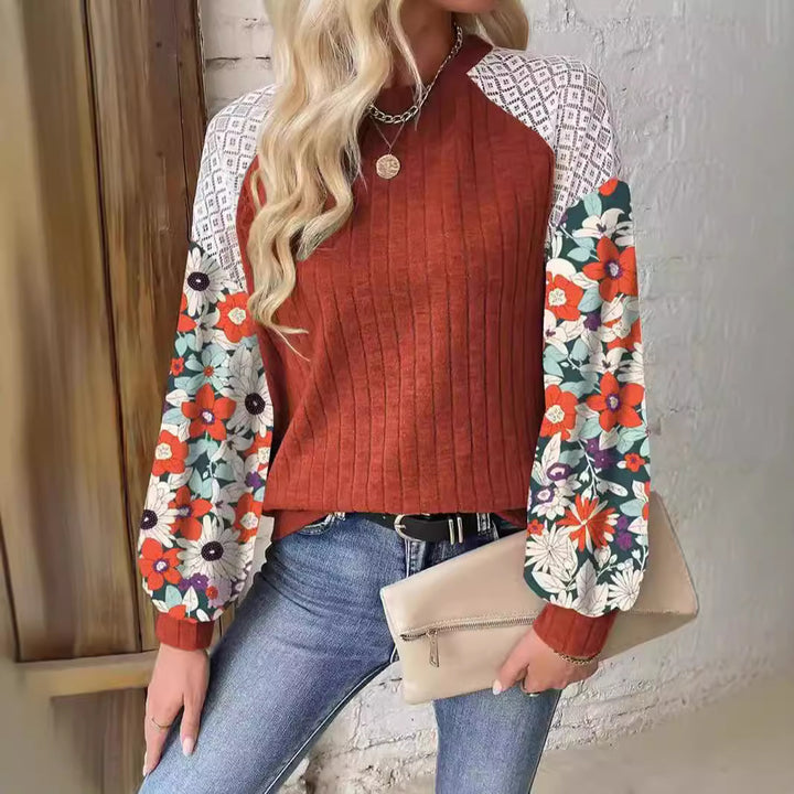 Women's sweater with a playful shape featuring a chic floral sleeve design