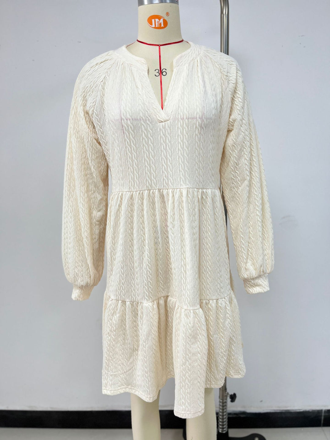 Casual women's dress with V-neck, puff sleeves, and ruffled hem Lune London