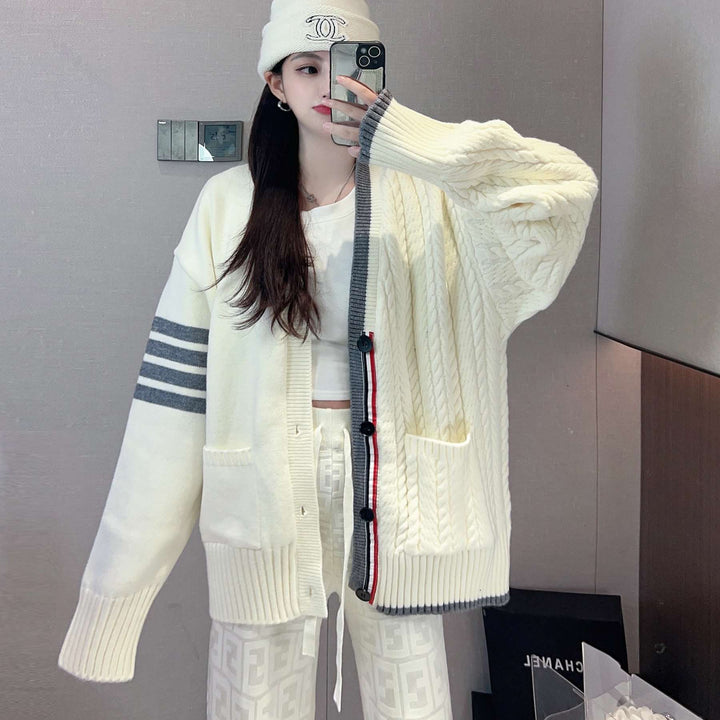 Women's chunky knit cardigan with cable pattern and generous pockets Lune London