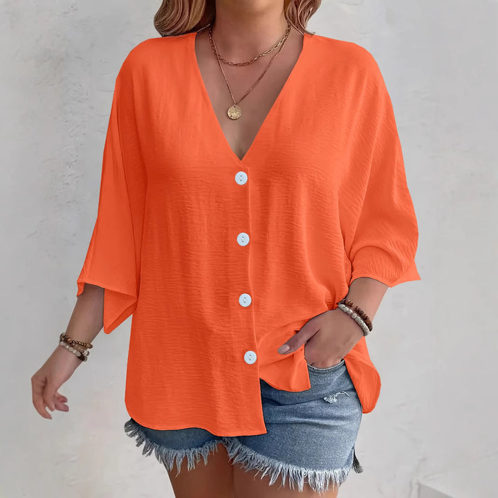 Short-sleeved advantageous blouse for ladies with button placket and V neckline Lune London