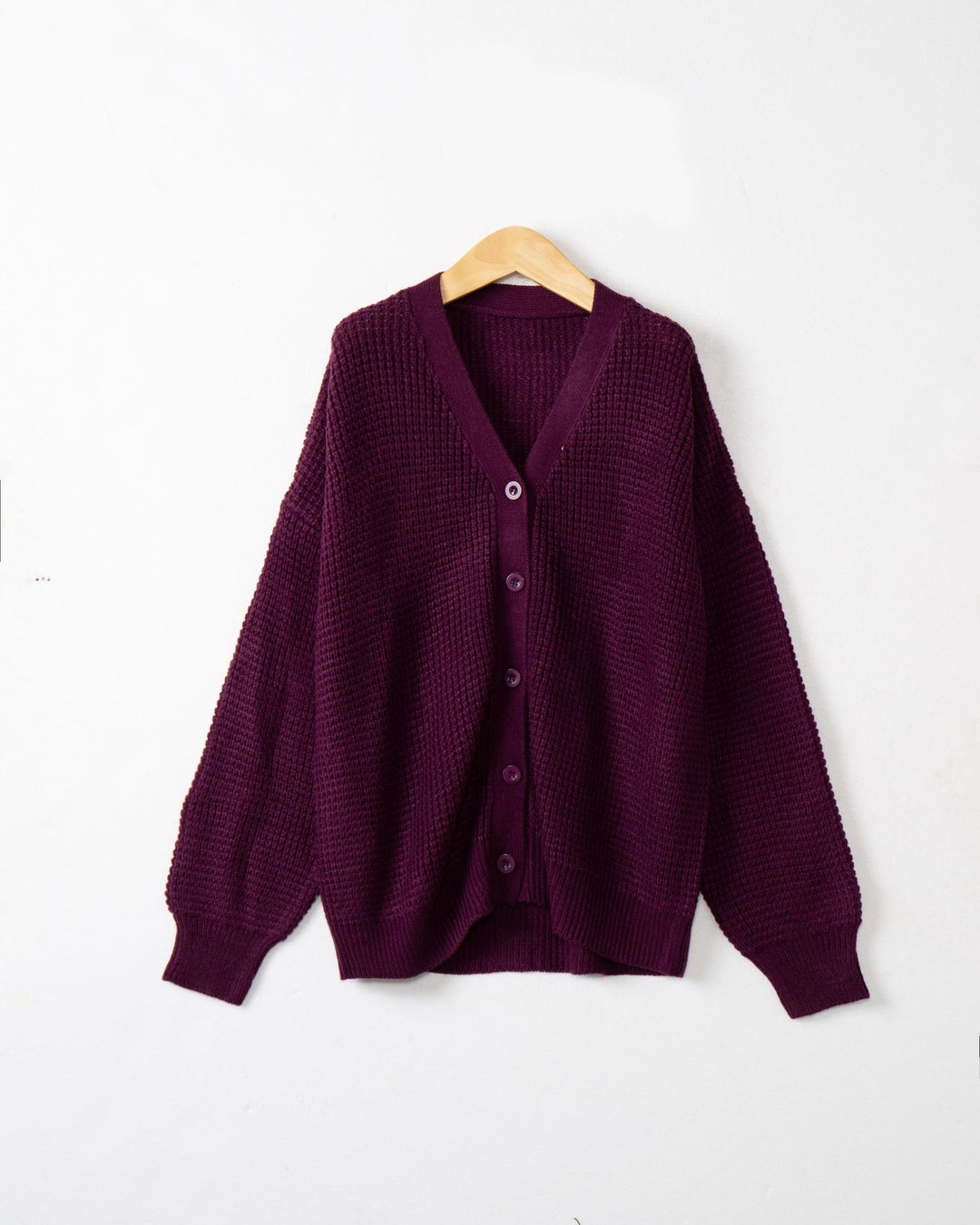 Women's knitted jacket with structured pattern and practical button details Lune London