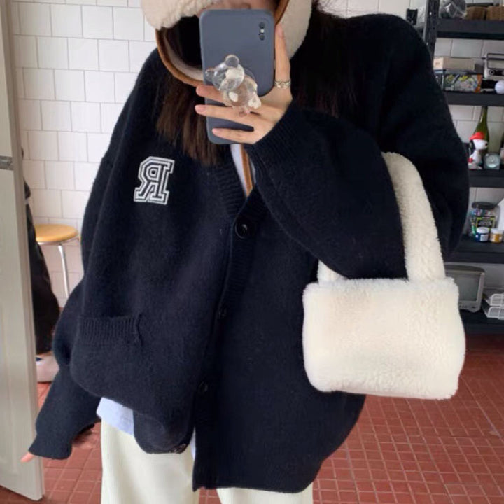 Casual knitted jacket for women with front pockets and button closure Lune London