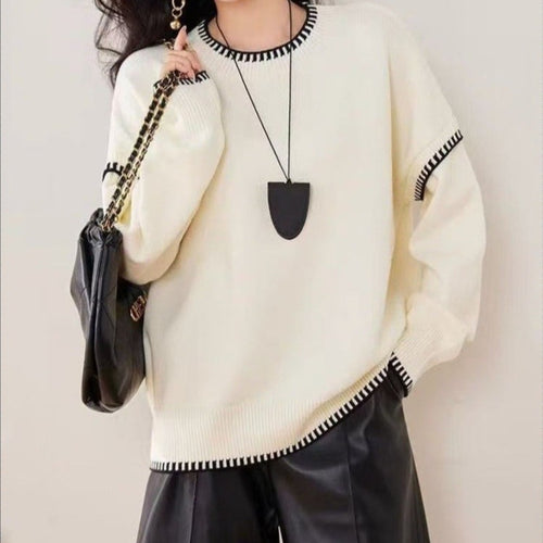 Pull confortable pour femme avec ourlet texturé et accents modernes Chic & Stil