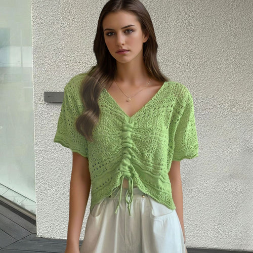 Women's knit top with decorative hole pattern and adjustable hem Lune London