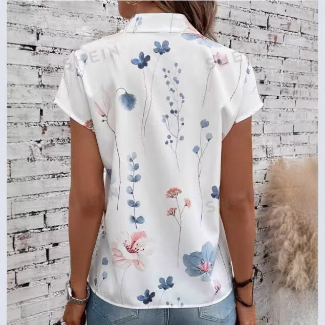 Women’s blouse with floral pattern and cape sleeves Lune London