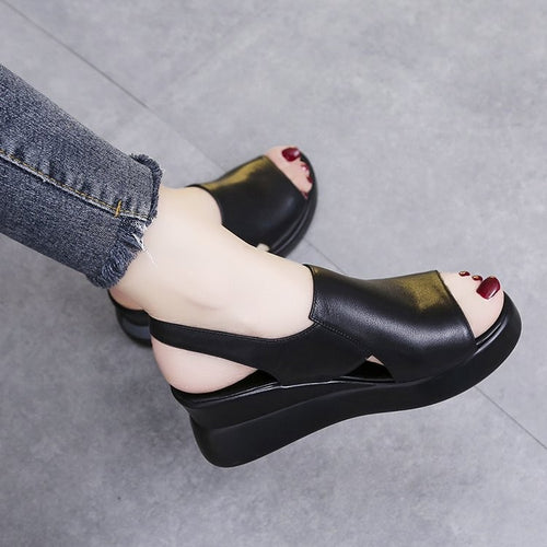 Comfortable wedge sandals for women with an adjustable strap and ergonomic insole technology Lune London