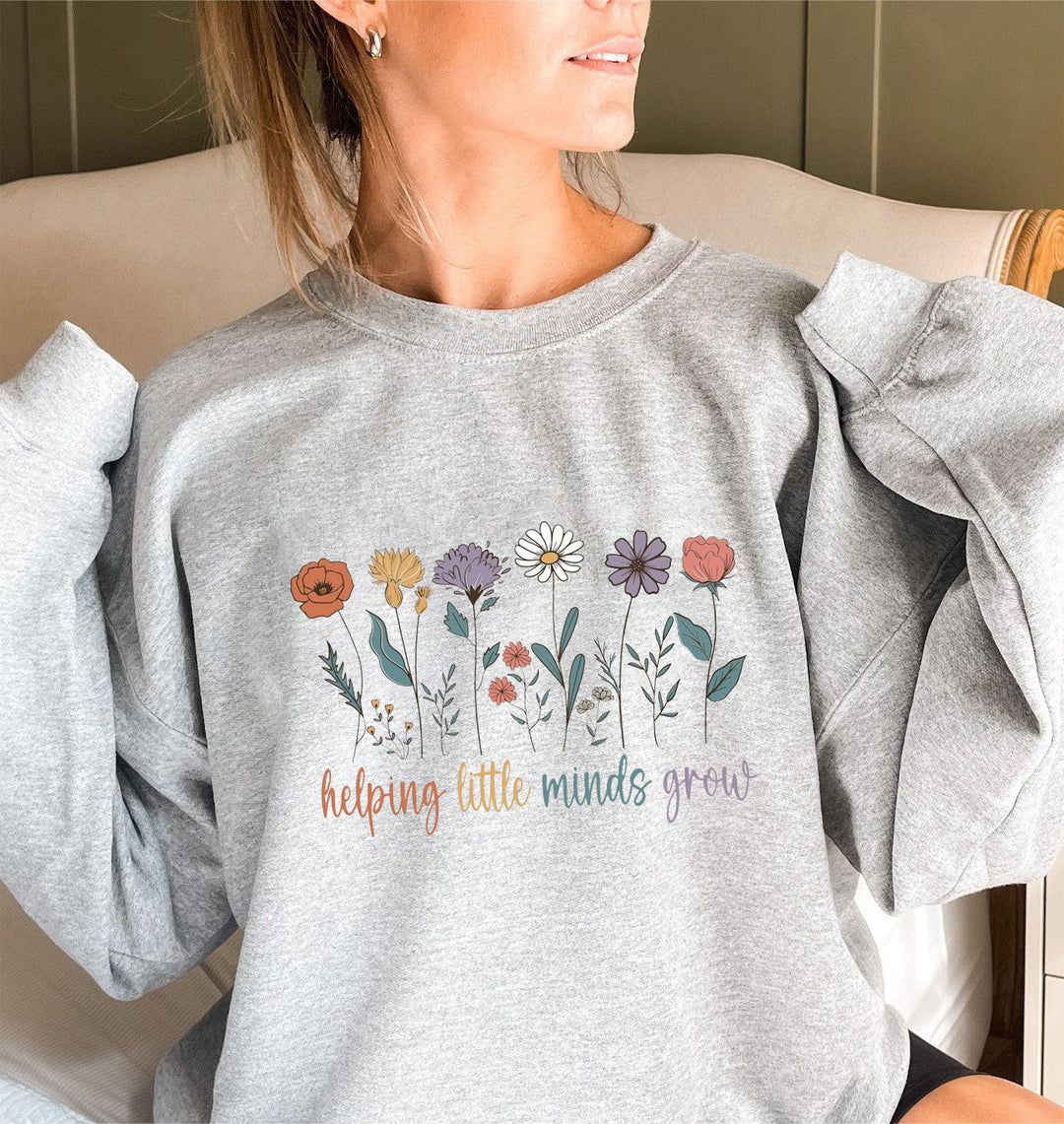 Sweat-shirt femme avec des manches volumineuses et un imprimé floral motivant Chic & Stil
