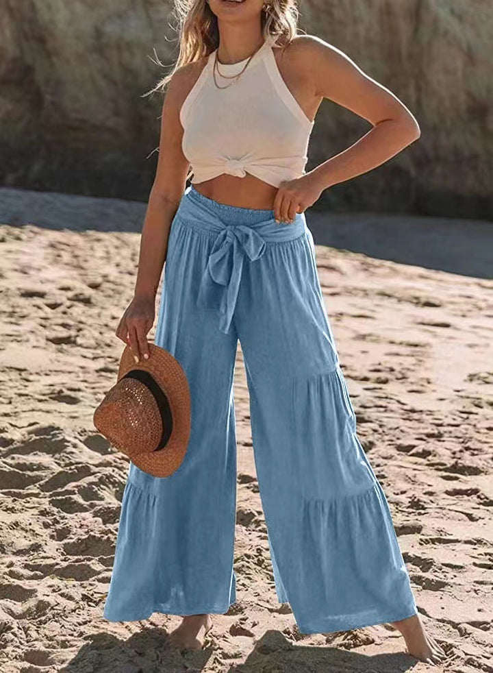 Airy palazzo pants for women with elastic waistband and practical tied belt Lune London