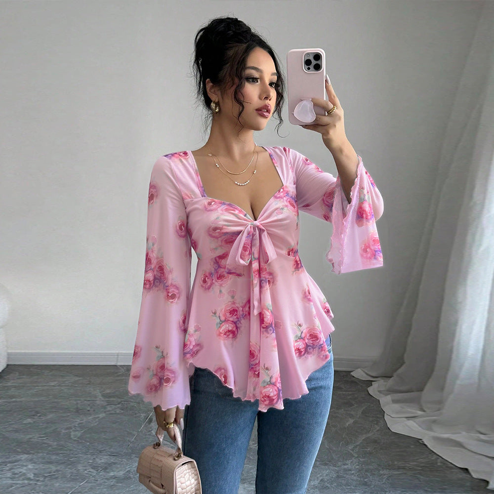 Blouse femme fluide avec design floral et nœud ludique Chic & Stil