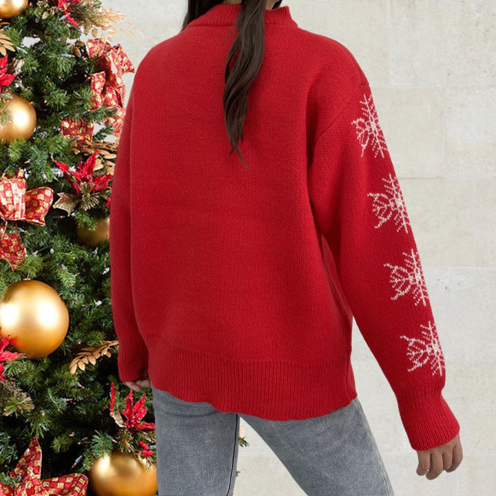 Christmas sweater for women with a cute reindeer pattern and winter snowflakes Lune London