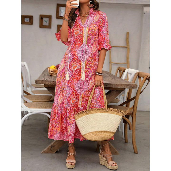 Maxi dress for women with playful paisley pattern and ruffled details Lune London