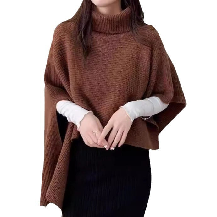 Ladies knitted poncho with high collar and asymmetrical cut Lune London