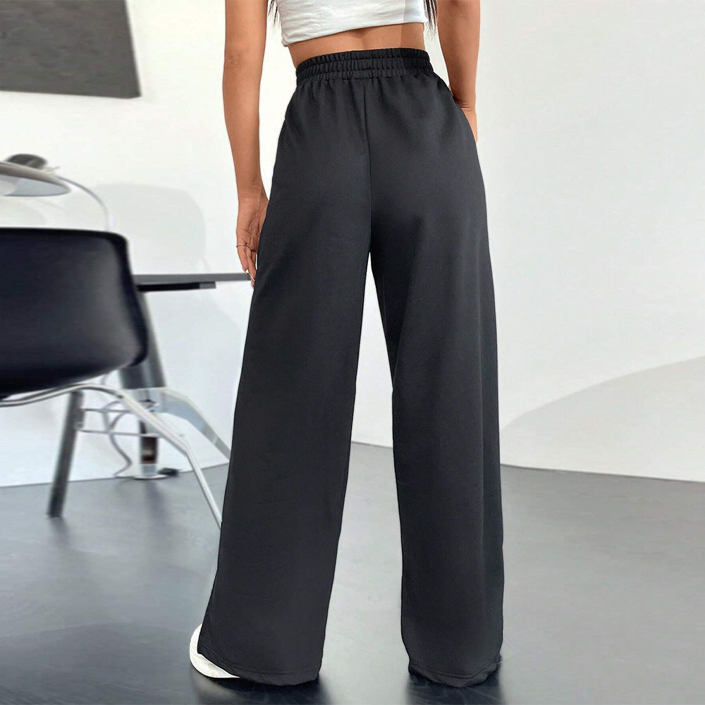 Pantalons satinés larges pour femmes avec taille élastique et fentes latérales Chic & Stil