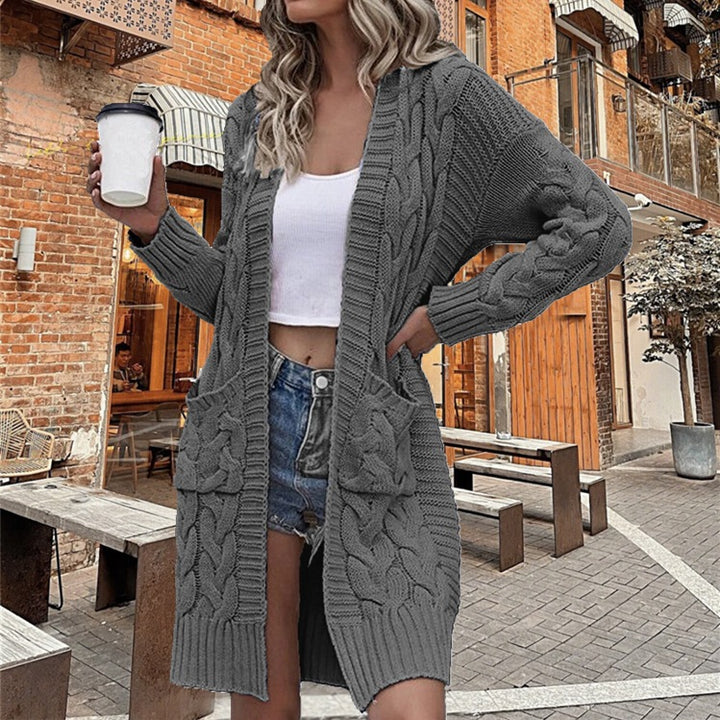 Ladies chunky knit cardigan with deep pockets and elaborate braids design Lune London