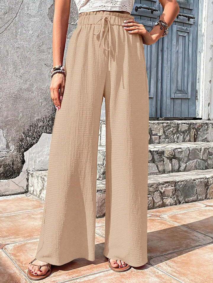 Loose summer pants for women with elastic waist and practical drawstring Lune London