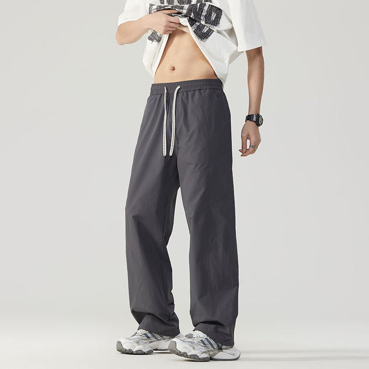 Pantalon de sport respirant pour hommes avec taille ajustable et poches zippées latérales Lune London