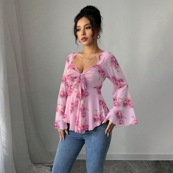 Blouse femme fluide avec design floral et nœud ludique Chic & Stil