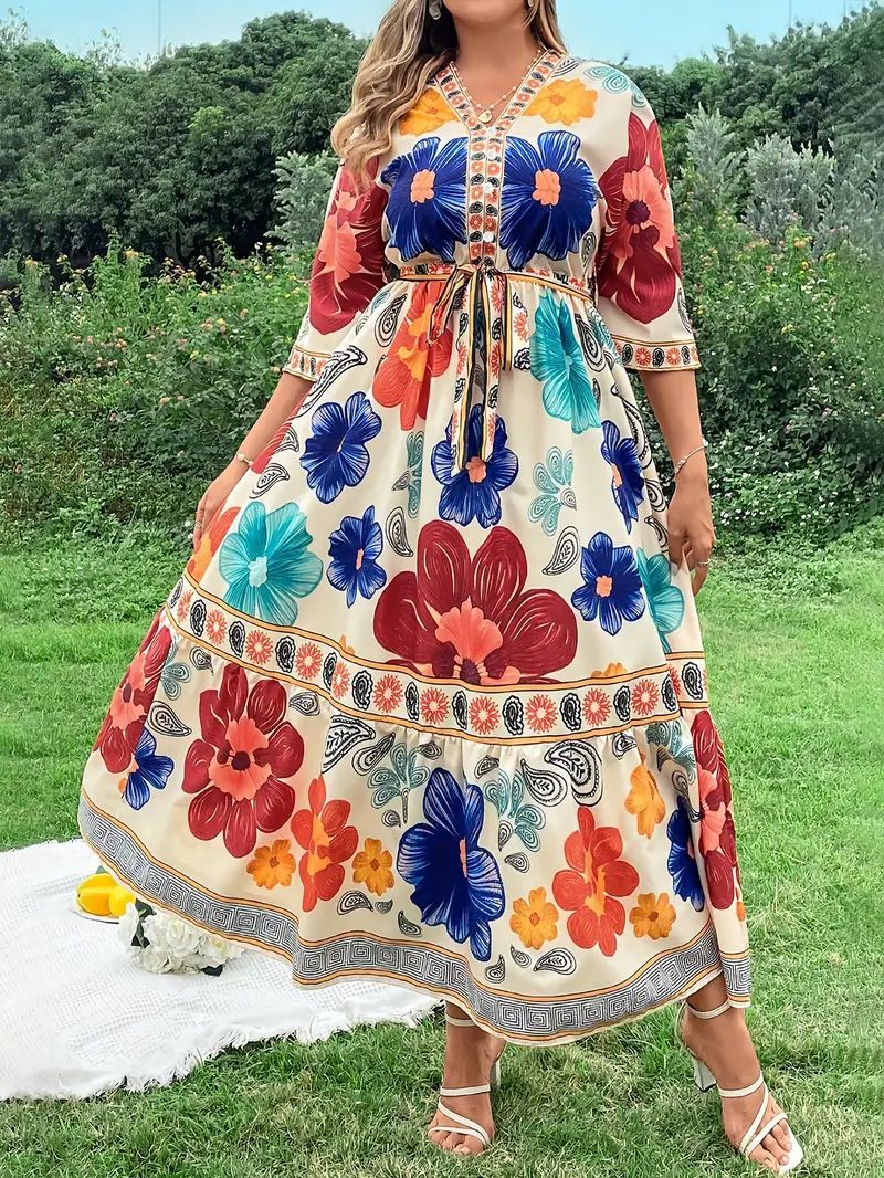 Women's maxi dress with colorful floral design and waist belt Lune London