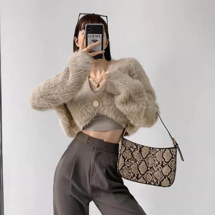Cropped knitted jacket for women with voluminous sleeves and button detail Lune London