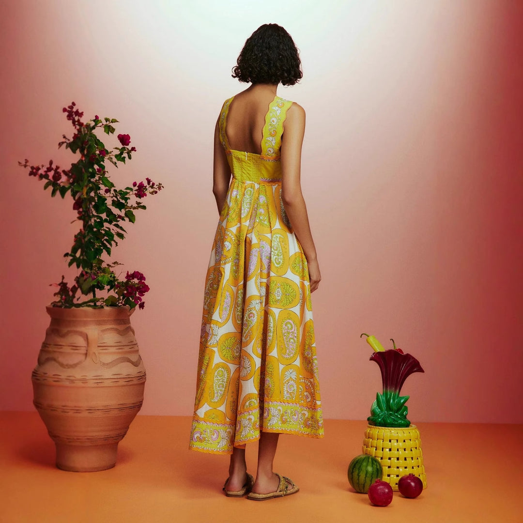 Women's maxi dress with playful paisley design and narrow waist belt Lune London
