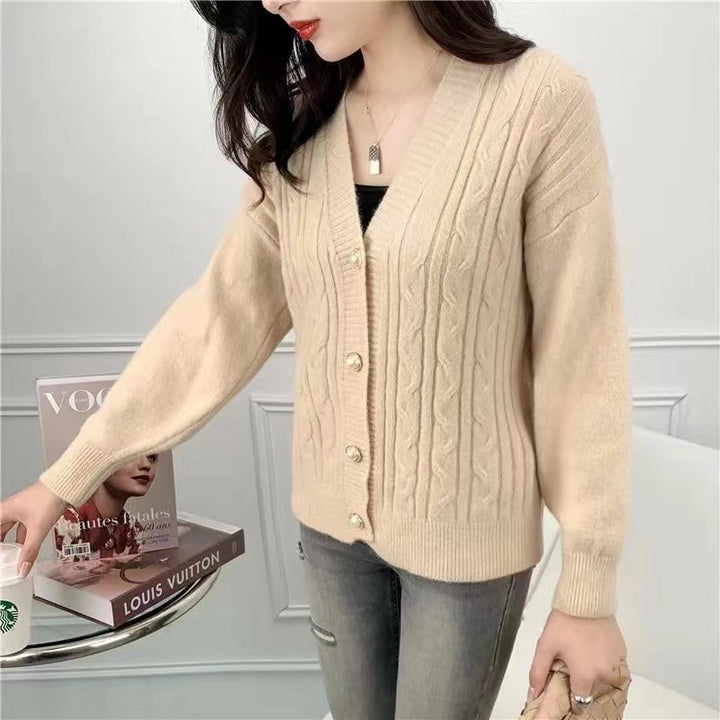 Knitted jacket for women with an elegant braid pattern and high-quality button details Lune London