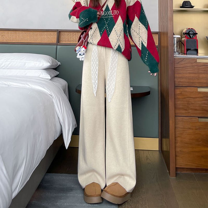 Pantalons larges taille haute pour femmes avec des détails de laçage décoratifs Chic & Stil