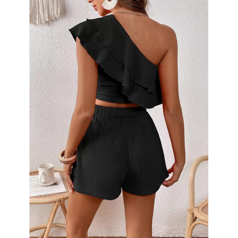 Woman One-Shoulder Ruffle Crop Top and High-Waisted Shorts Lune London