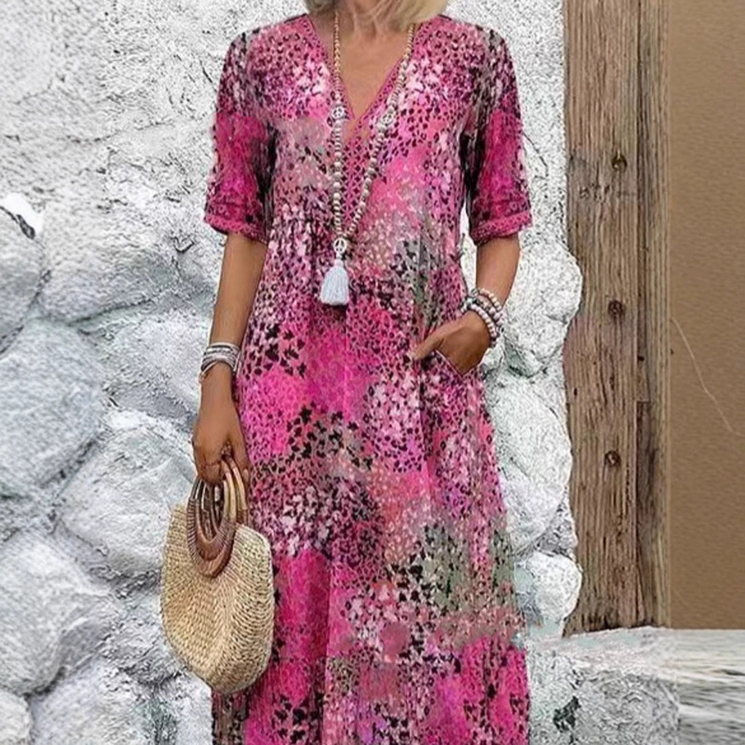 Maxi dress for women with V-neckline and practical side pockets Lune London