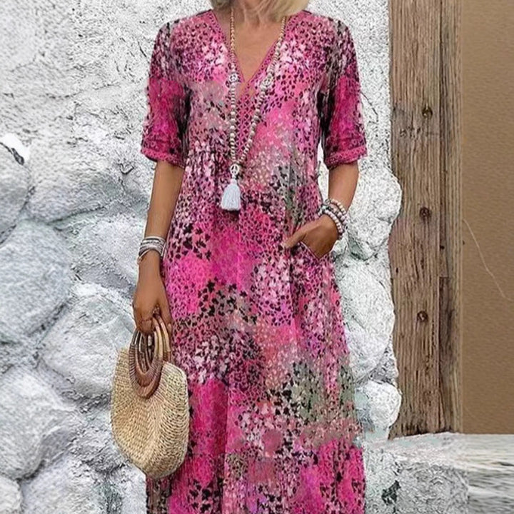 Maxi dress for women with V-neckline and practical side pockets Lune London
