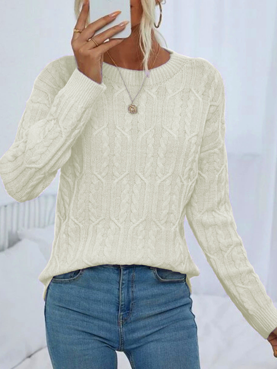 Ladies knit sweater with cable pattern demanding Lune London