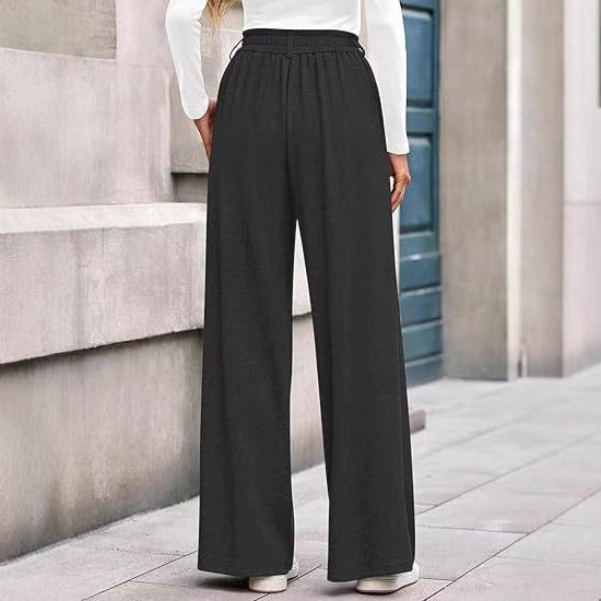 Loose fabric trousers for women with high waist and practical pockets. Chic and style