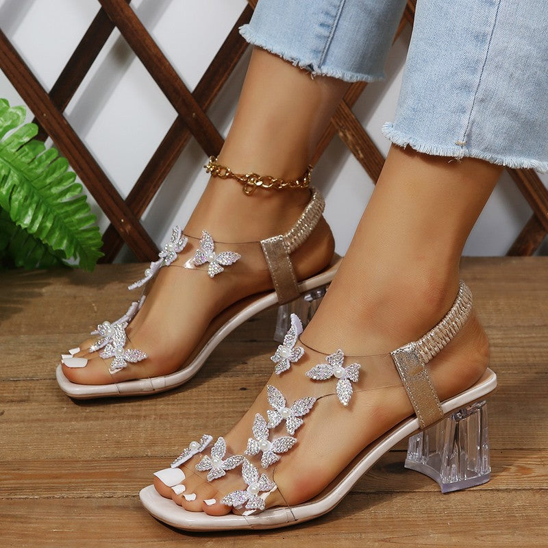 Glamour sandals for ladies with sparkling butterfly details and a transparent block heel Lune London