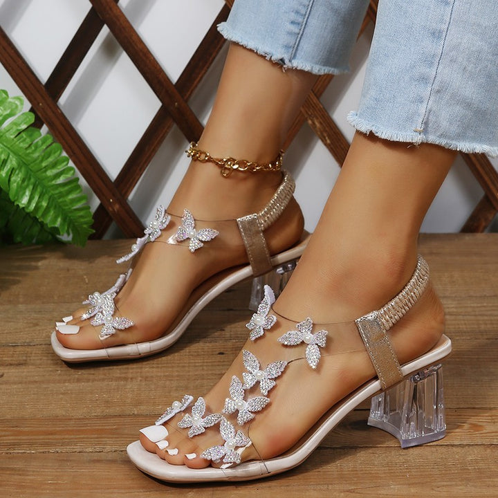 Glamour sandals for ladies with sparkling butterfly details and a transparent block heel Lune London