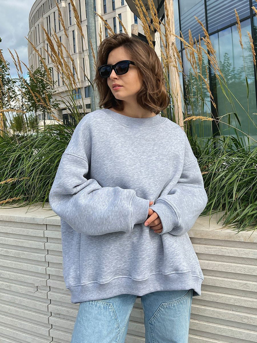 Woman Oversized sweatshirt with a relaxed fit and modern chic accents and style