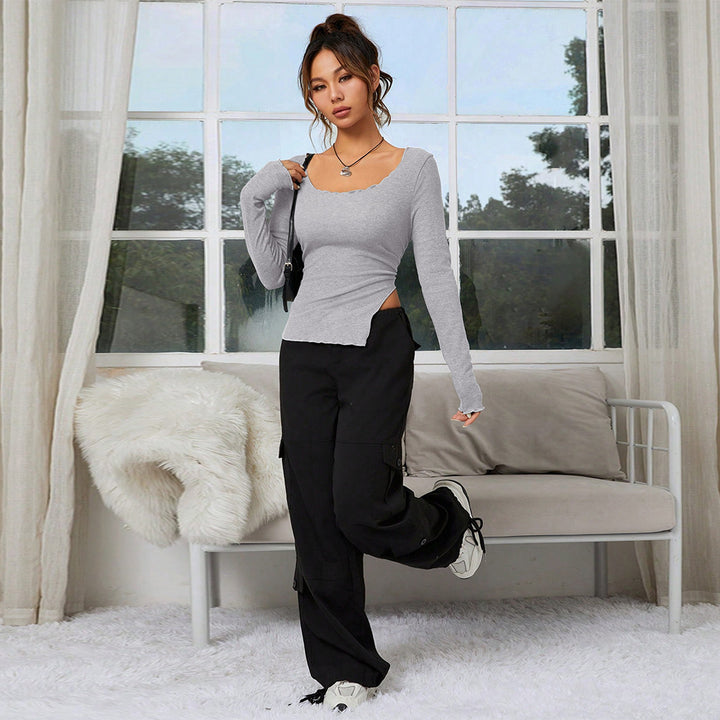Chemisier femme ajusté à manches longues avec ourlet asymétrique et décolleté élégant Chic & Stil