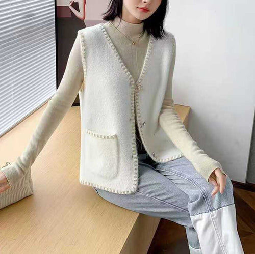 Ladies knitted vest with decorative button details Lune London