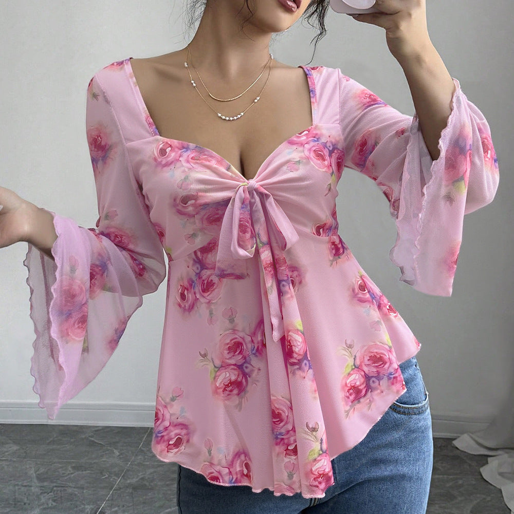 Blouse femme fluide avec design floral et nœud ludique Chic & Stil