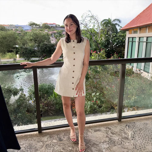 Sleeveless shirt dress for women with practical pockets and decorative button details Lune London
