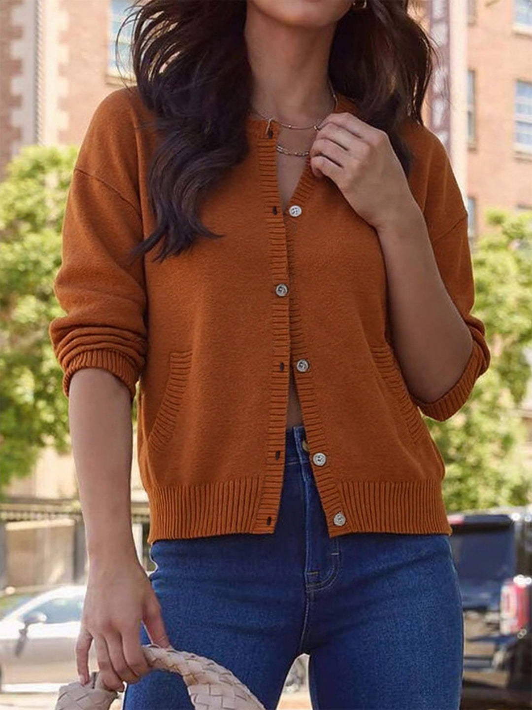 Elegant ladies cardigan with button details and practical pockets Lune London