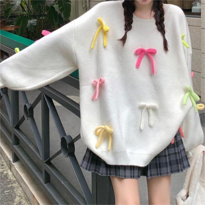 Casual sweater for women with playful bow appliqués Lune London