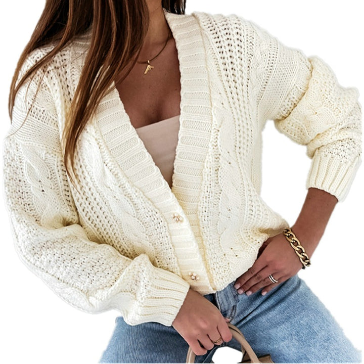 Women's knitted jacket with decorative cable design and unique button details Lune London