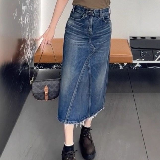 Women's maxi skirt in a casual denim style with asymmetrical hem and fringes Lune London