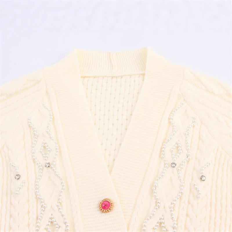 Knitted jacket for women with a detailed textured pattern and elegant ruffle details Lune London