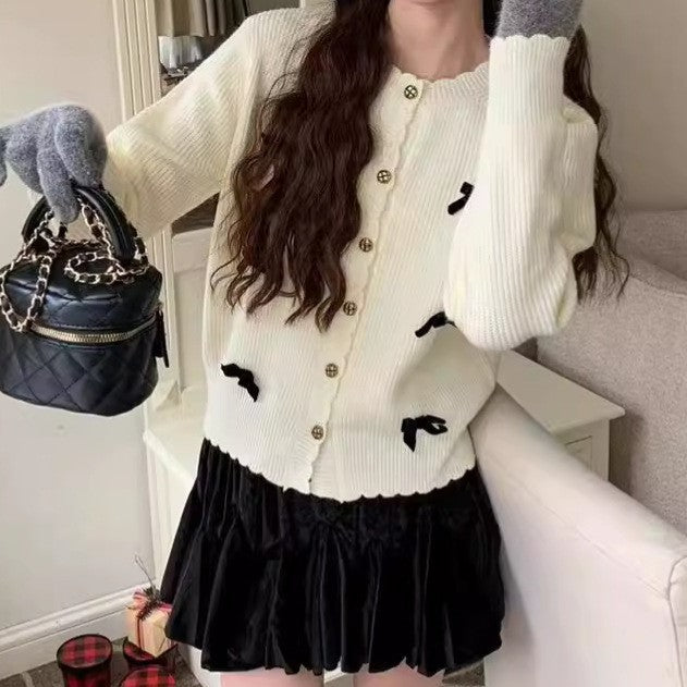 Women's knitted jacket with a playful design and decorative button details Lune London