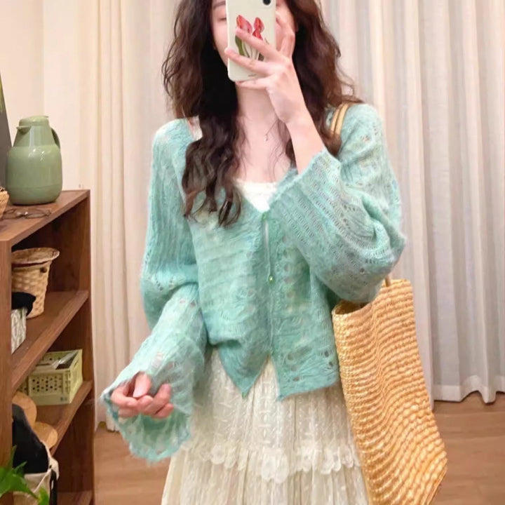 Lightweight knit cardigan for women with a fine openwork knit structure and a loose fit Lune London