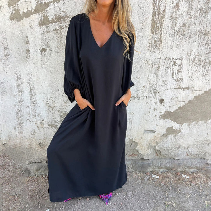 Maxi dress for women with deep V-neckline and practical side pockets Lune London