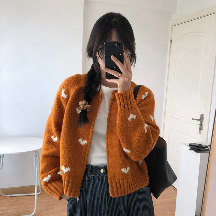 Ladies comfortable cardigan with heart pattern and chic style elegant button detail