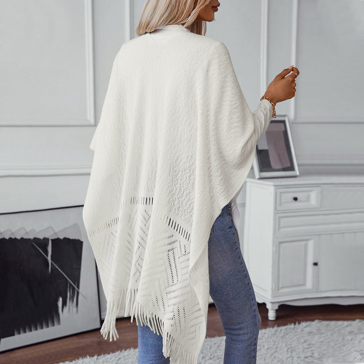 Elegant knitted poncho for women with fringe details and a distinctive pattern Lune London